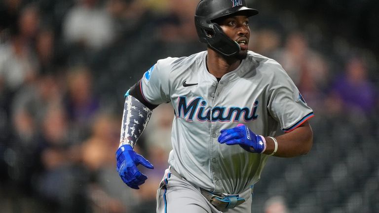 Miami Marlins' Jesus Sanchez heads up the first-base line after...