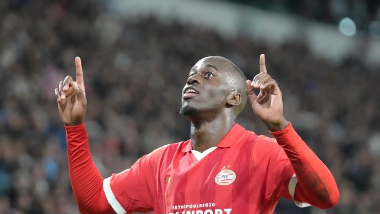 PSV's Jordan Teze celebrates after scoring his side's second goal...