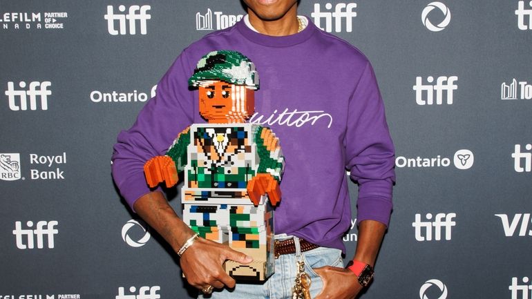 Pharrell Williams arrives on the red carpet for the premiere...