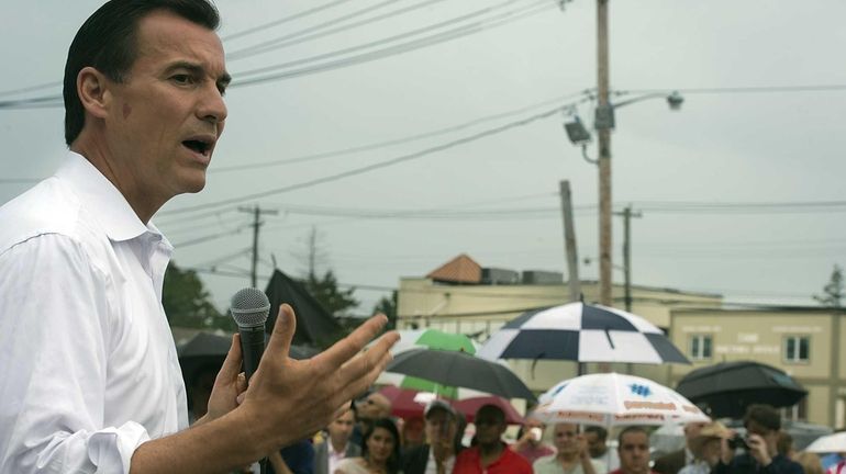 Former Nassau County Executive Tom Suozzi talks to a crowd...