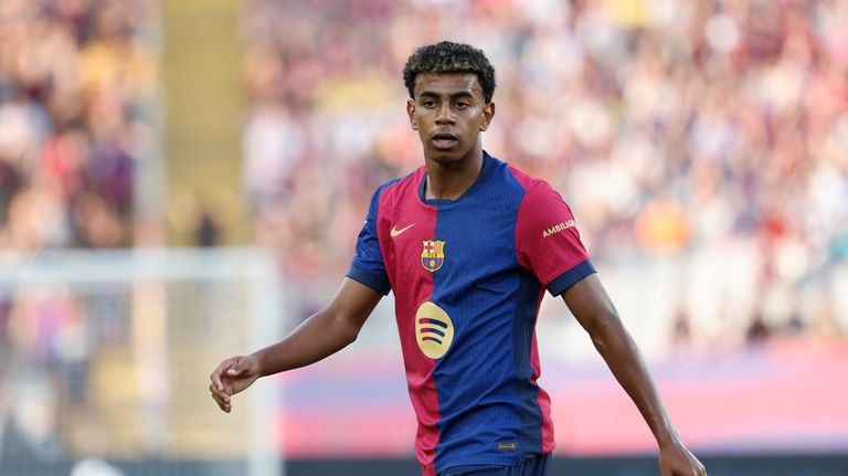 Barcelona's Lamine Yamal attends the Spanish La Liga soccer match...