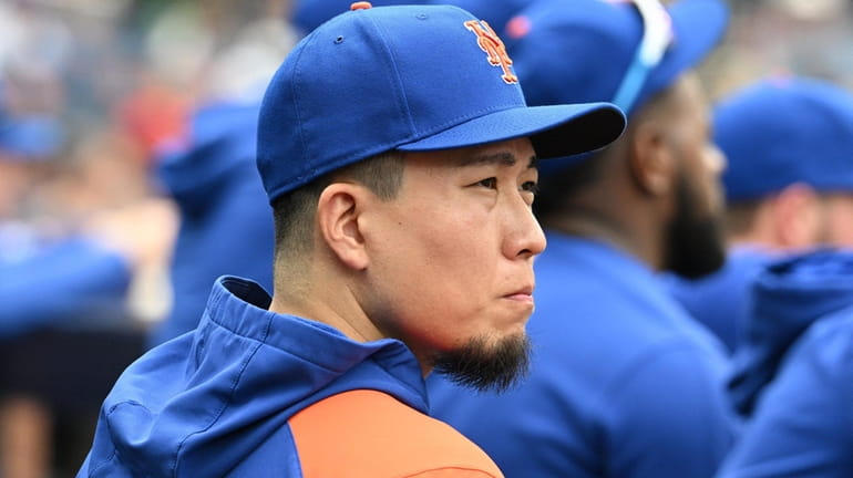 Mets pitcher Kodai Senga looks on from the dugout during...