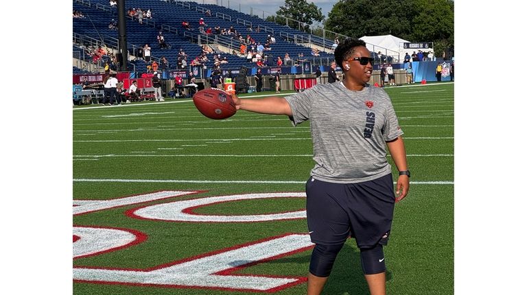 Chicago Bears coach Jennifer King gestures on the field in...