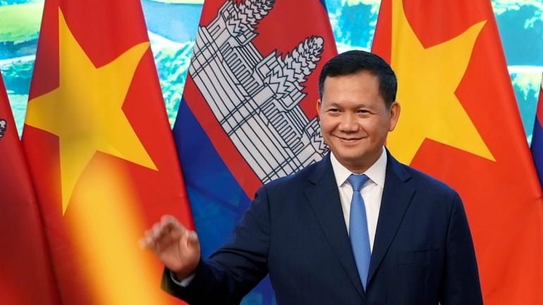Cambodian Prime Minister Hun Manet poses for photo, in Hanoi,...