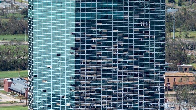 This aerial photo shows broken windows of the Hertz Building...