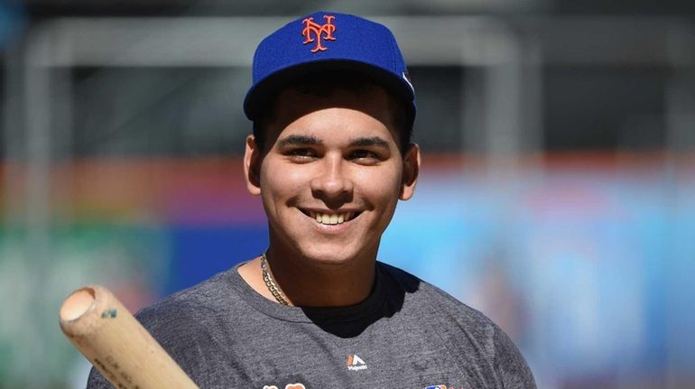 New York Mets shortstop Ruben Tejada looks on during a...