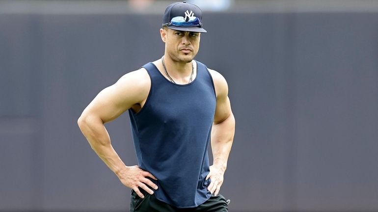 Giancarlo Stanton of the Yankees works out on the field...