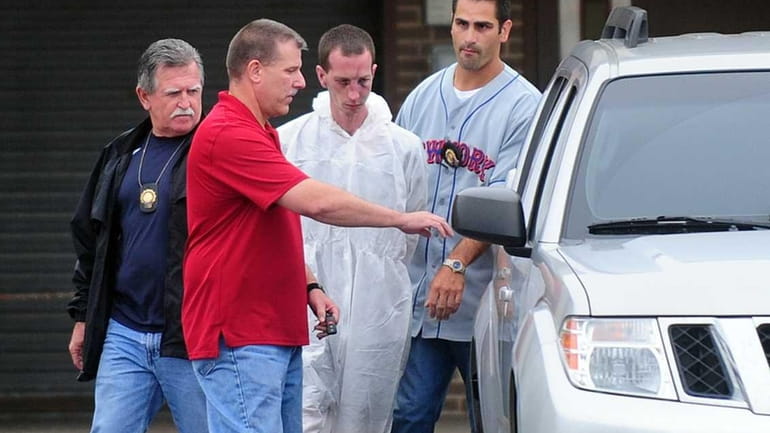 David Laffer is taken from Suffolk police headquarters. (June 22,...