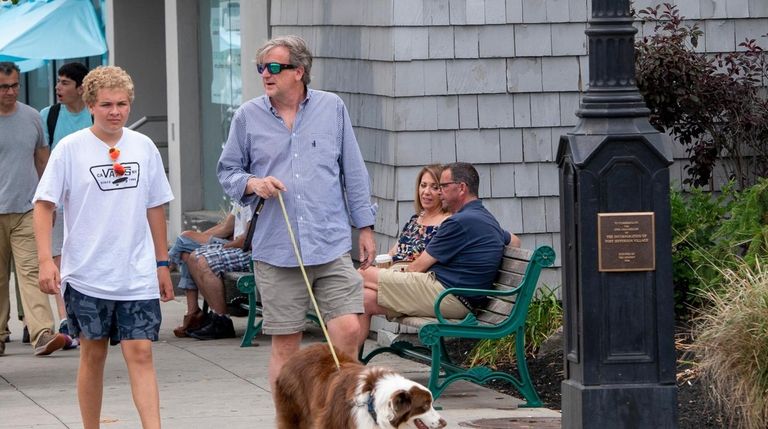 A family strolls Main Street in Port Jefferson. 