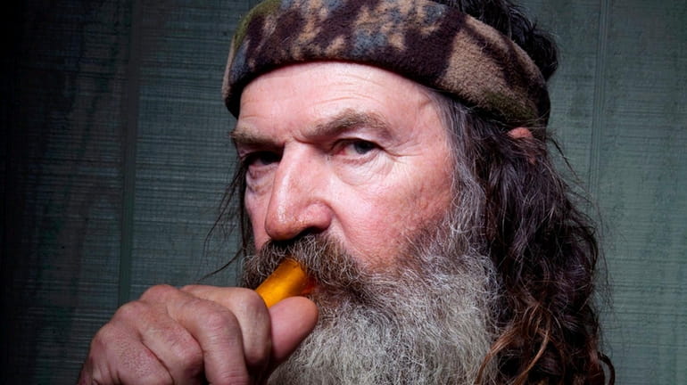 Phil Robertson poses with a mouth-blown duck call stars in...