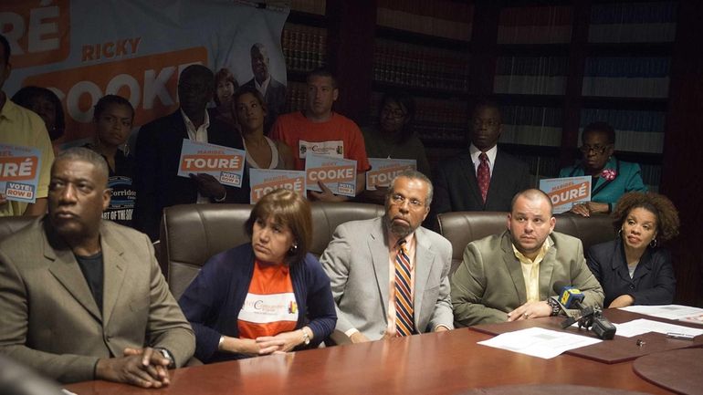 Maribel Touré, attorney Fred Brewington and Ricky Cooke at a...