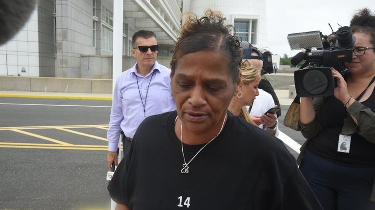 Elizabeth Alvarado, the mother of MS-13 victim Nisa Mickens, leaves...