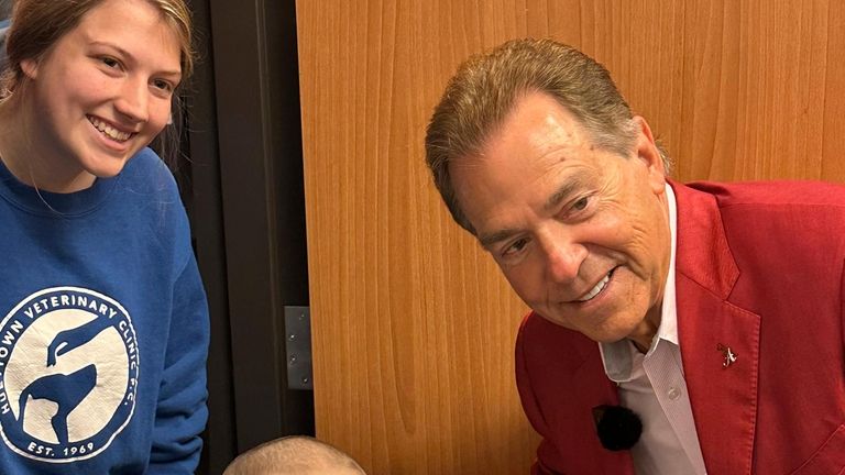 Alabama NCAA college football head coach Nick Saban poses with...