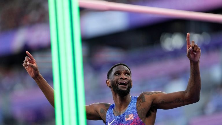 Shelby McEwen, of the United States, reacts in the men's...