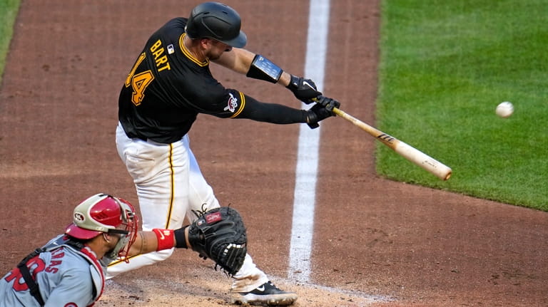 Pittsburgh Pirates' Joey Bart (14) hits a sacrifice fly off...