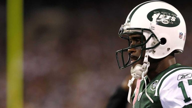 Plaxico Burress #17 of the New York Jets stands on...