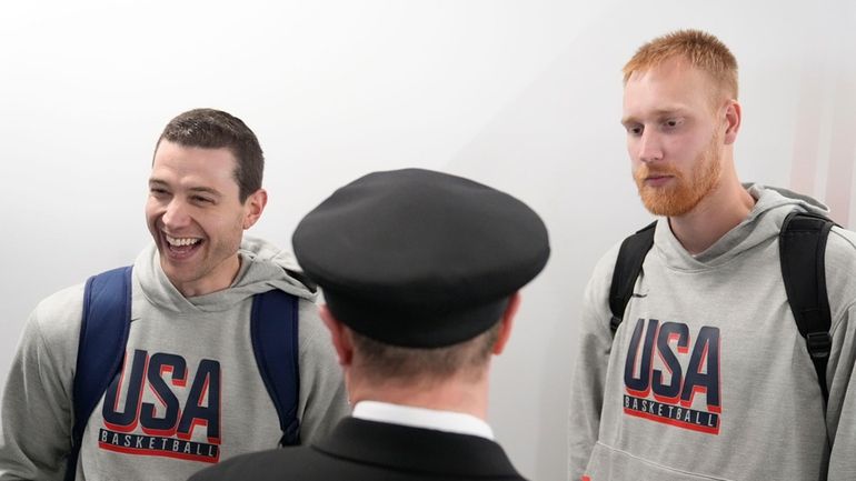 Team USA basketball athletes, Mitch Hahn, right, and Jimmer Fredette,...