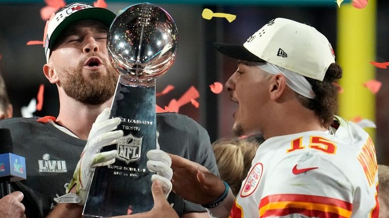 Kansas City Chiefs tight end Travis Kelce, left, and quarterback...