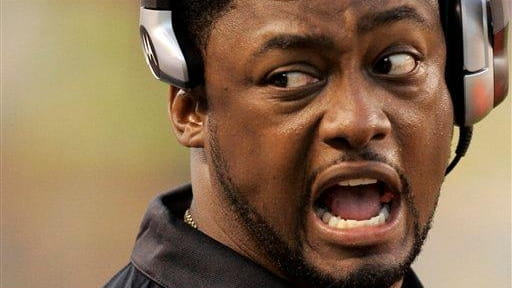 Pittsburgh Steelers head coach Mike Tomlin congratulates players on his...
