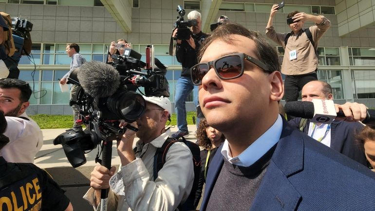 Rep. George Santos leaves federal court in Central Islip after...