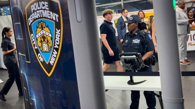 Gun detection machines are tested at the Fulton Street transit...