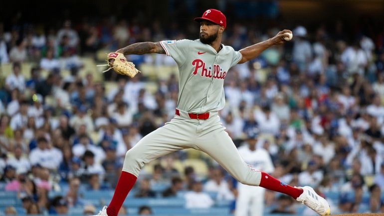 Philadelphia Phillies starting pitcher Cristopher Sánchez delivers a pitch during...