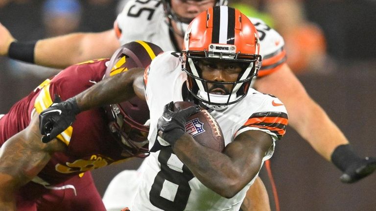 Browns wide receiver Elijah Moore runs with the ball during an...