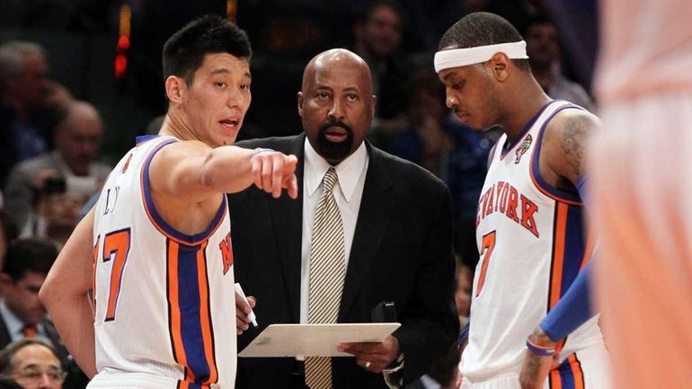 Interim head coach Mike Woodson, Carmelo Anthony #7 and Jeremy...