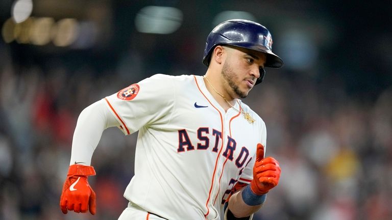 Houston Astros' Yainer Diaz rounds the bases after hitting a...