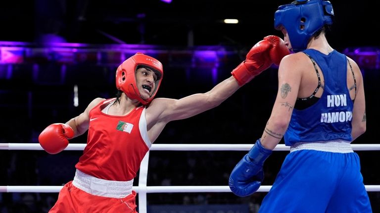 Algeria's Imane Khelif hits Hungary's Anna Hamori in their women's...