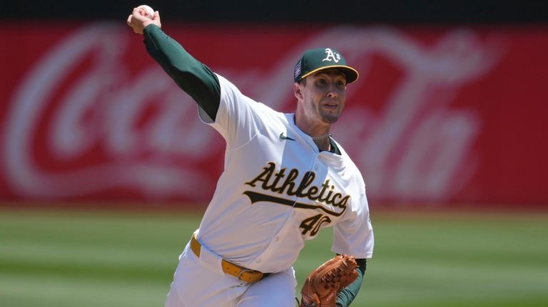 Oakland Athletics pitcher Mitch Spence works against the Los Angeles...