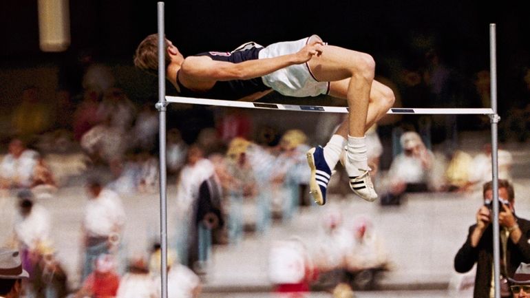 FILE - Dick Fosbury, of the United States, clears the...