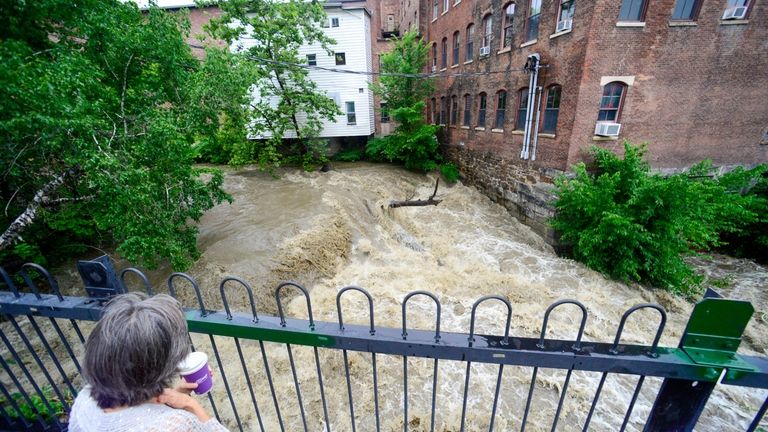 Melissa Morgan, of Northfield, Mass., looks at the water flow...