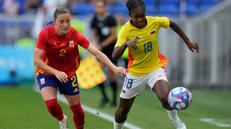 Colombia's Linda Caicedo, right, and Spain's Ona Batlle battle for...