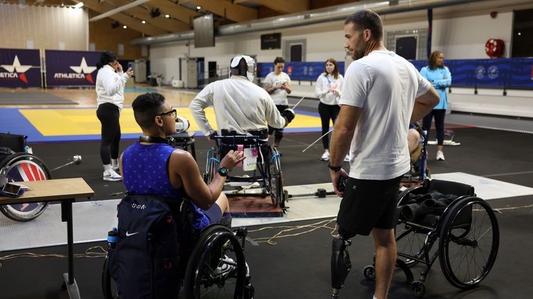 Wheelchair fencer Jataya Taylor from the U.S., left, and U.S....