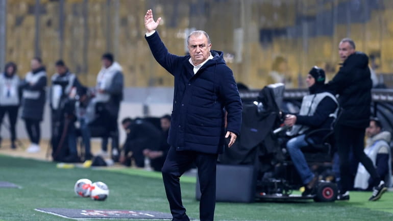 Panathinaikos' head coach Fatih Terim instructs his players during a...