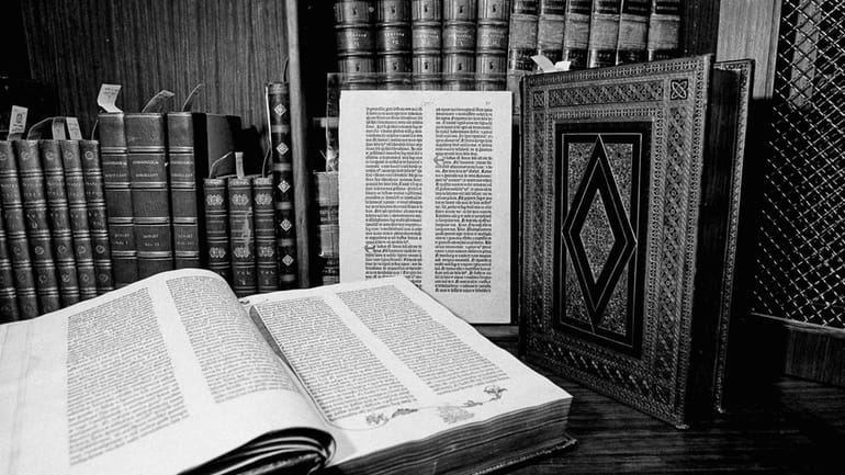 Two volumes of the over 500-year-old Gutenberg Bible are pictured...
