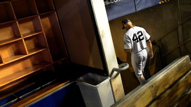 Mariano Rivera leaves the field for the last time as...