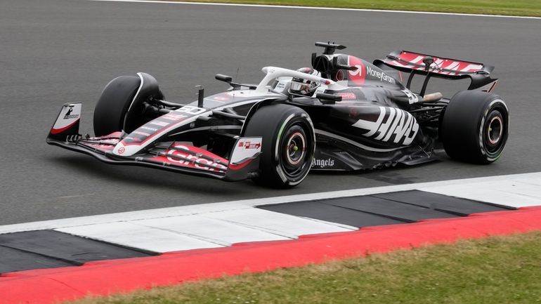 Haas driver Oliver Bearman of Britain steers his car during...