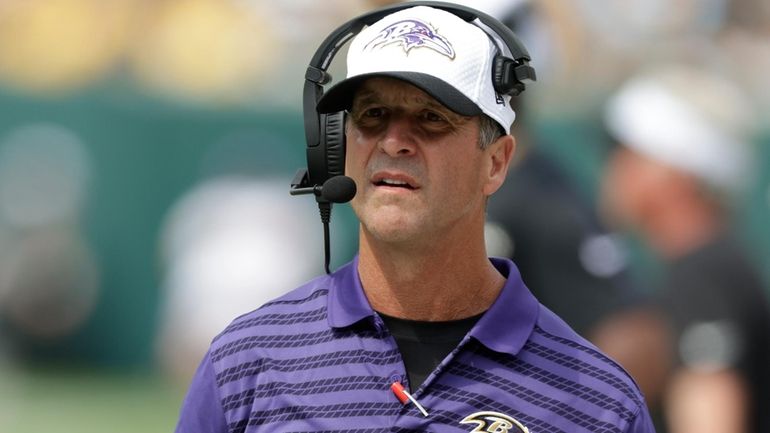 Baltimore Ravens head coach Jiohn Harbaugh watches during the second...