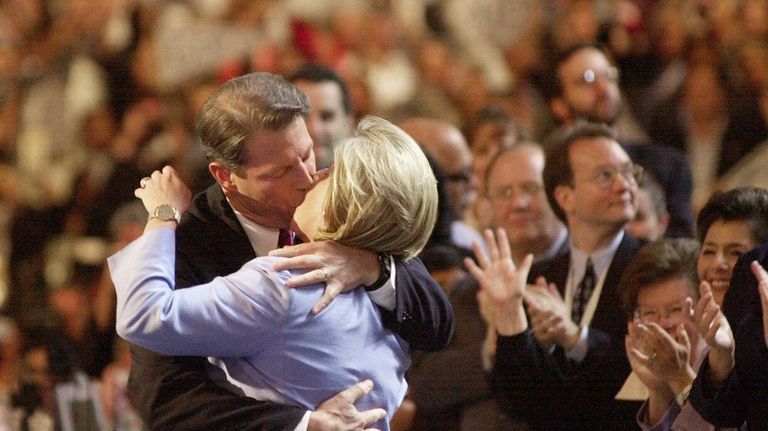 Democratic presidential nominee Al Gore kisses his wife, Tipper Gore...