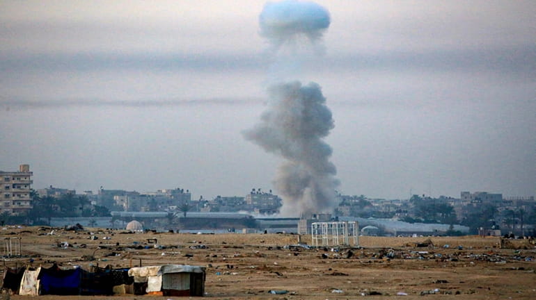 Smoke billows following Israeli bombardment in Rafah in the southern...