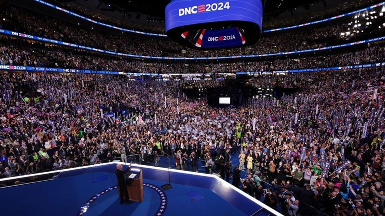 President Joe Biden waves to the crowd during the Democratic...