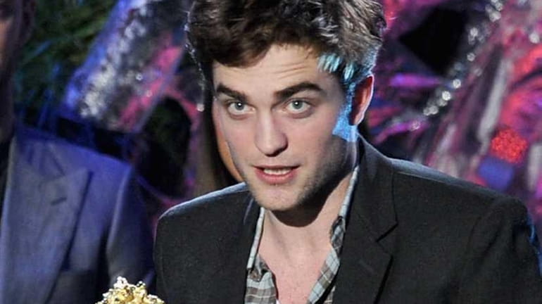 Actor Robert Pattinson accepts the Best Male Performance onstage during...