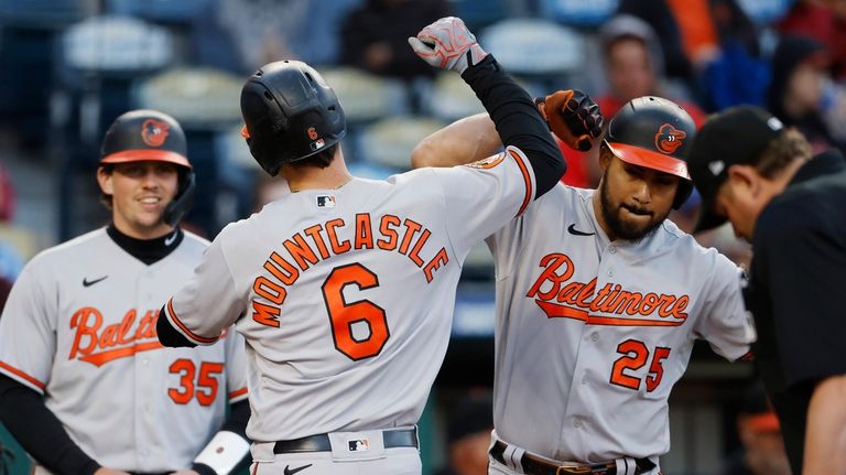 Baltimore Orioles' Ryan Mountcastle (6) celebrates with Anthony Santander (25)...