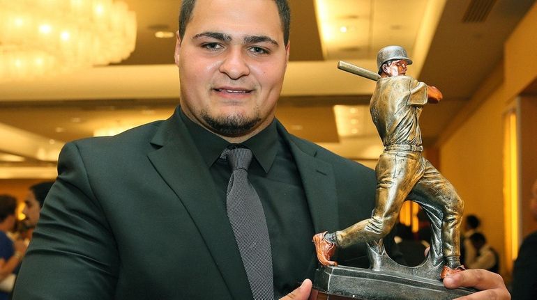 Carey's Anthony Catapano holds his Don Lang Diamond Award at...