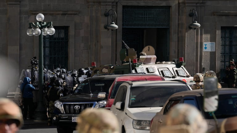 Military Police gather outside the main entrance to the presidential...