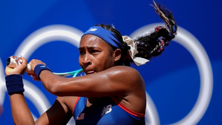 Coco Gauff of the United States returns the ball against...