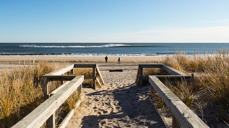 A boardwalk leads to the ocean at Sagg Main Beach,...