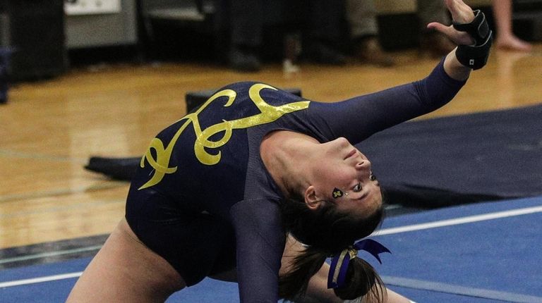 Jennifer Mullan of Massapequa competes in the floor exercise at...